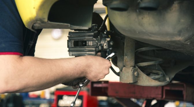 Mechanic working on car