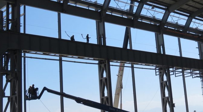 workers on high scaffolding